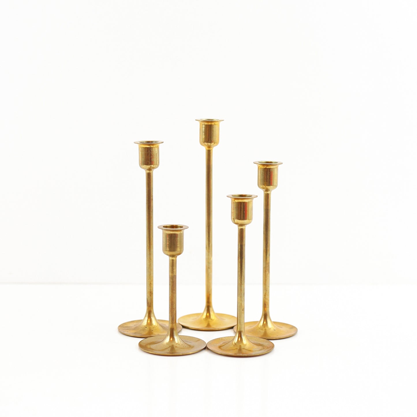 SOLD - Mid Century Graduated Brass Candlesticks