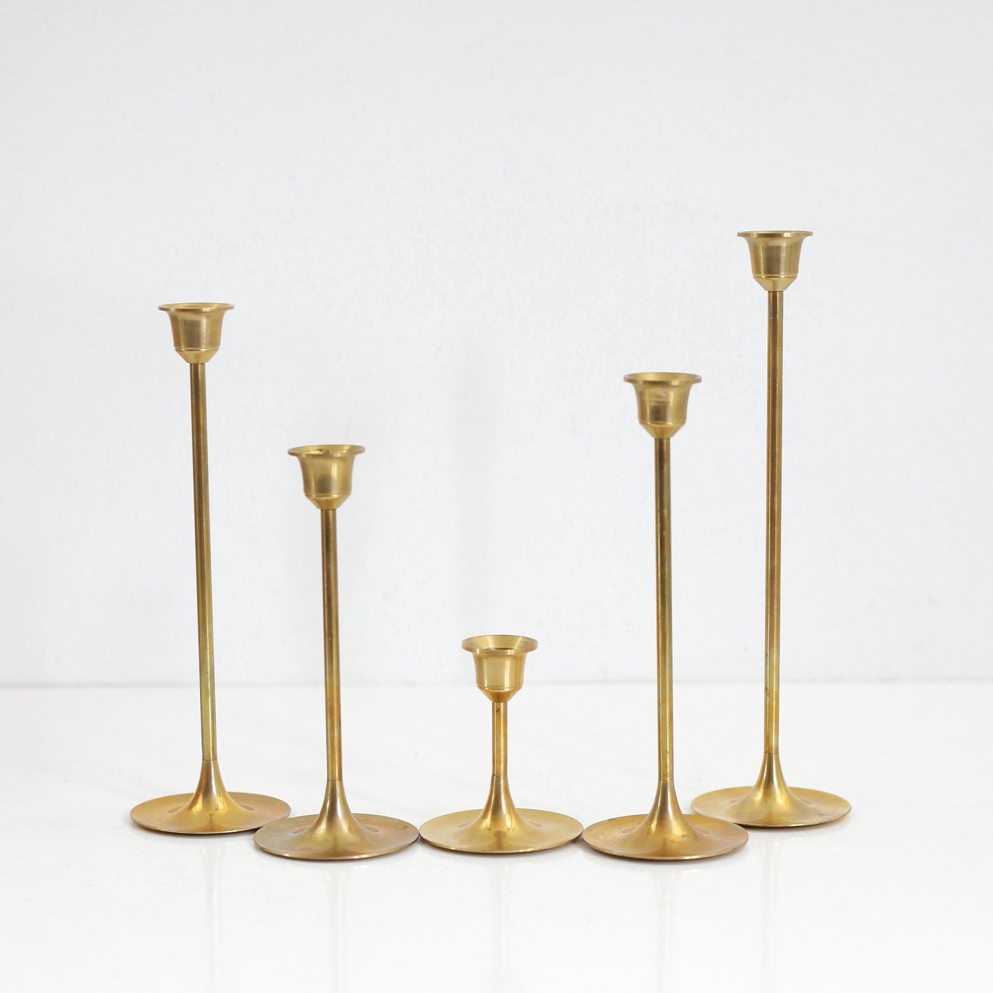 SOLD - Mid Century Graduated Brass Candlesticks - Set of Five