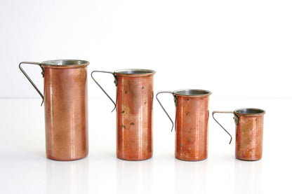 SOLD - Mid Century Copper and Brass Revere Ware Measuring Cups Set