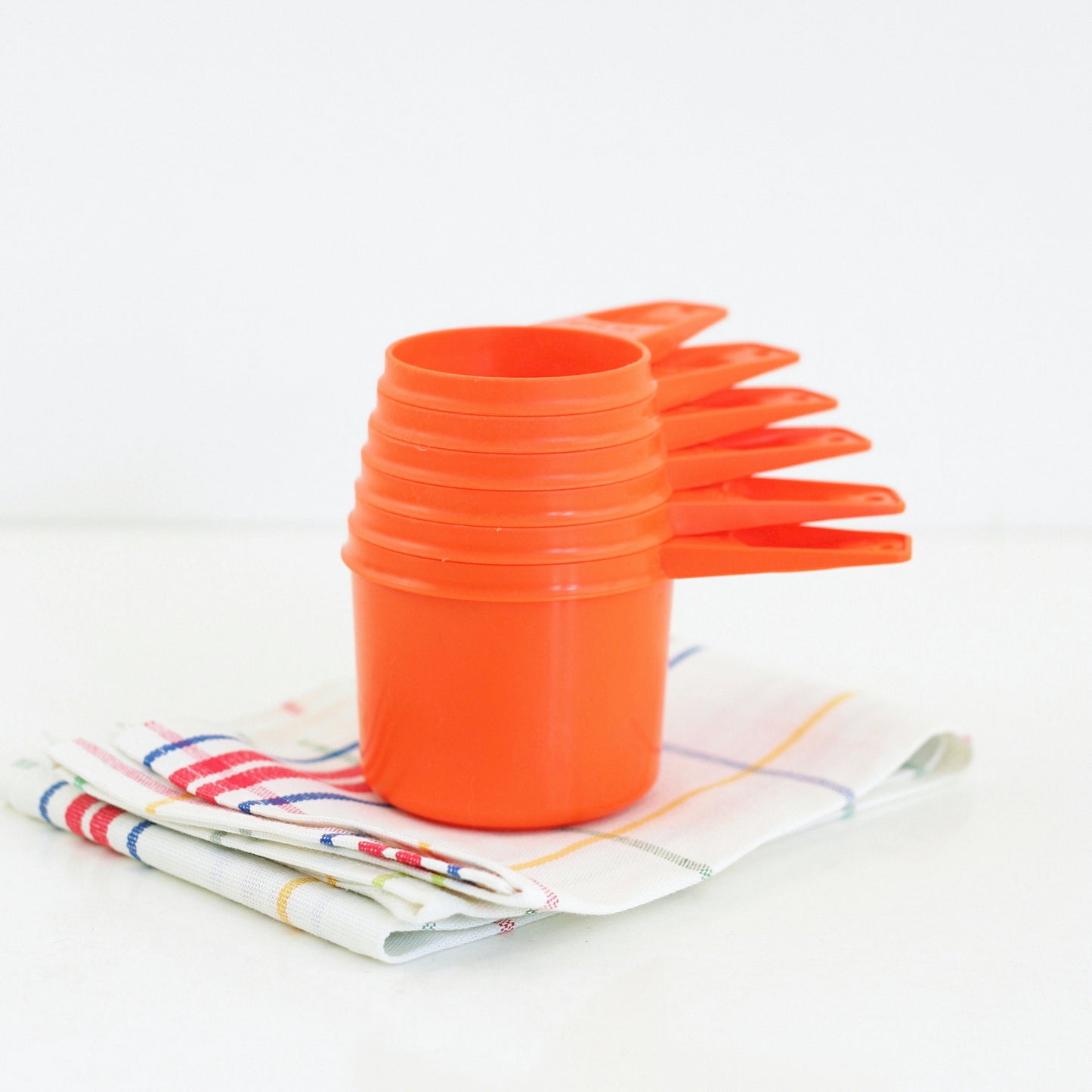 SOLD - Vintage Orange Tupperware Measuring Cups Set