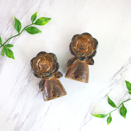 SOLD - Vintage Stoneware Flower Faces Salt and Pepper Shakers