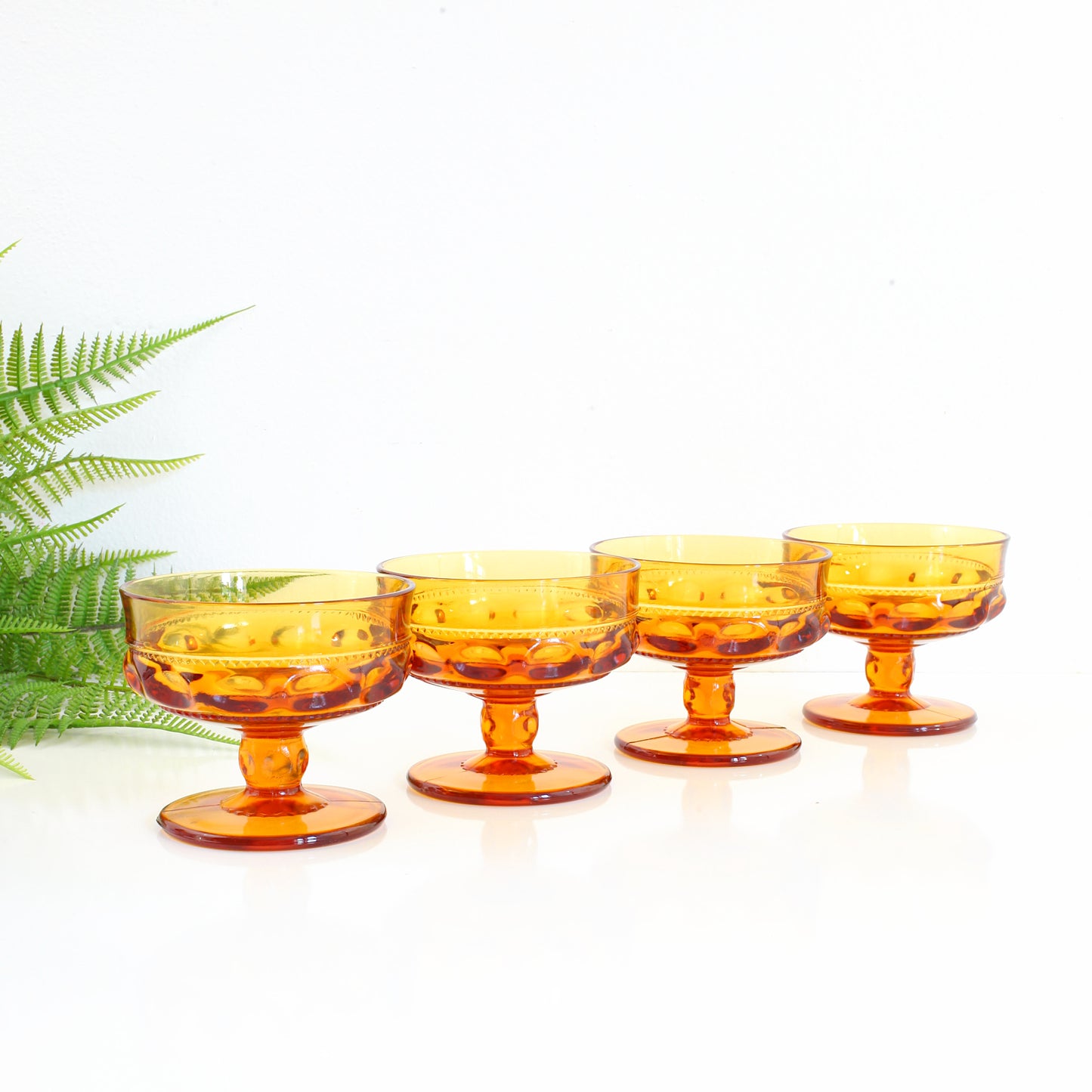 SOLD - Vintage Amber King's Crown Thumbprint Champagne Glasses